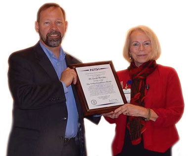Environmental Report LLNL scientist Leon Berzins received the NNSA Excellence Medal from Anne Harrington, the NNSA deputy administrator for Defense Nuclear Nonproliferation, for his management of the successful Source Physics Experiment-4 Prime campaign cover.