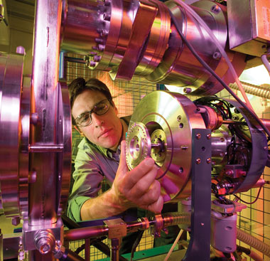 Environmental Report At Livermore’s Center for Accelerator Mass Spectrometry, Ted Ognibene loads a sample in a tandem accelerator used mainly for biological research. cover.