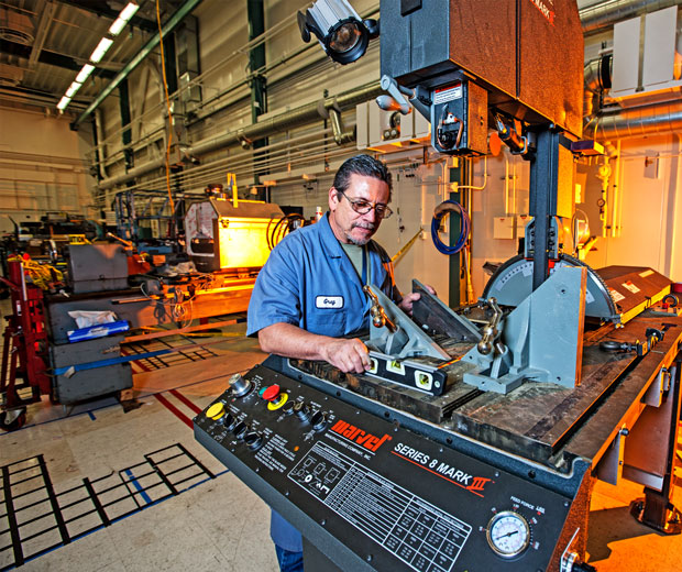 Environmental Report With support from NNSA’s Capability-Based Infrastructure Program, LLNL refurbished existing and procured new equipment to address current and future Stockpile Stewardship Program needs. Technician Greg Ciraulo is inspecting a band saw, which underwent extensive modifications so that it could be used for safely sawing radiological materials. cover.