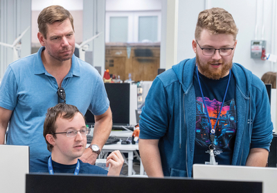 U.S. Representative Eric Swalwell (left) views activities at LLNL’s Cyber and Critical Infrastructure Summer Institute in July 2023.