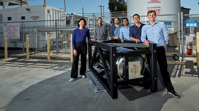 Researchers from LLNL and Verne stand next to Verne’s 117-gallon cryo-compressed hydrogen storage system, tested at LLNL.