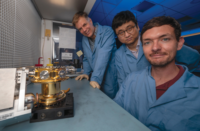 Researchers display a prototype of the high-purity gamma-ray spectrometer that they designed and built for a journey to the Psyche asteroid.