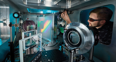 A technologist at the Jupiter Laser Facility aligns the COMET laser system for user experiments.