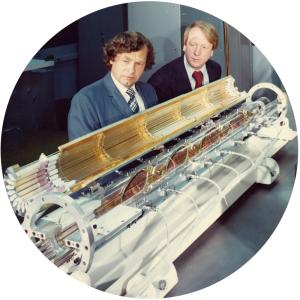Carl Haussmann (left) and John Emmett inspect a laser amplifier at LLNL in 1973