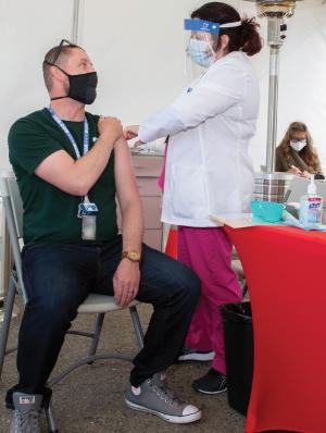 An LLNL employee receives a vaccine at LLNL Health Services during the COVID-19 pandemic.